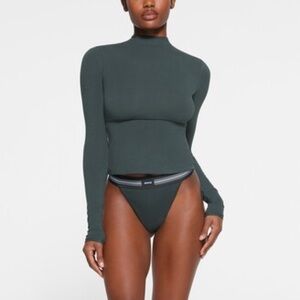 SKIMS COTTON JERSEY TURTLENECK TOP SPRUCE